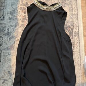 Elegant Black Sleeveless Shirt with Embellished Neckline